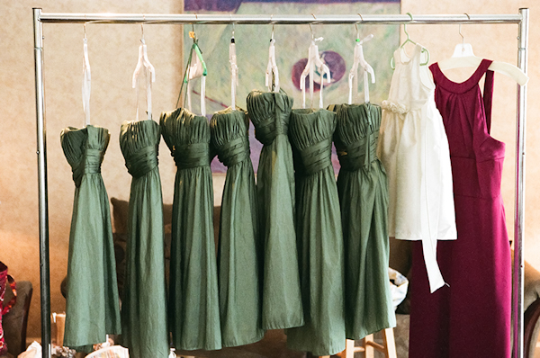 sage green bridesmaids dresses, white flower girl dress and dark pink maid of honor dress hanging - sweet southern military style wedding photo by Charleston wedding photographer Virgil Bunao